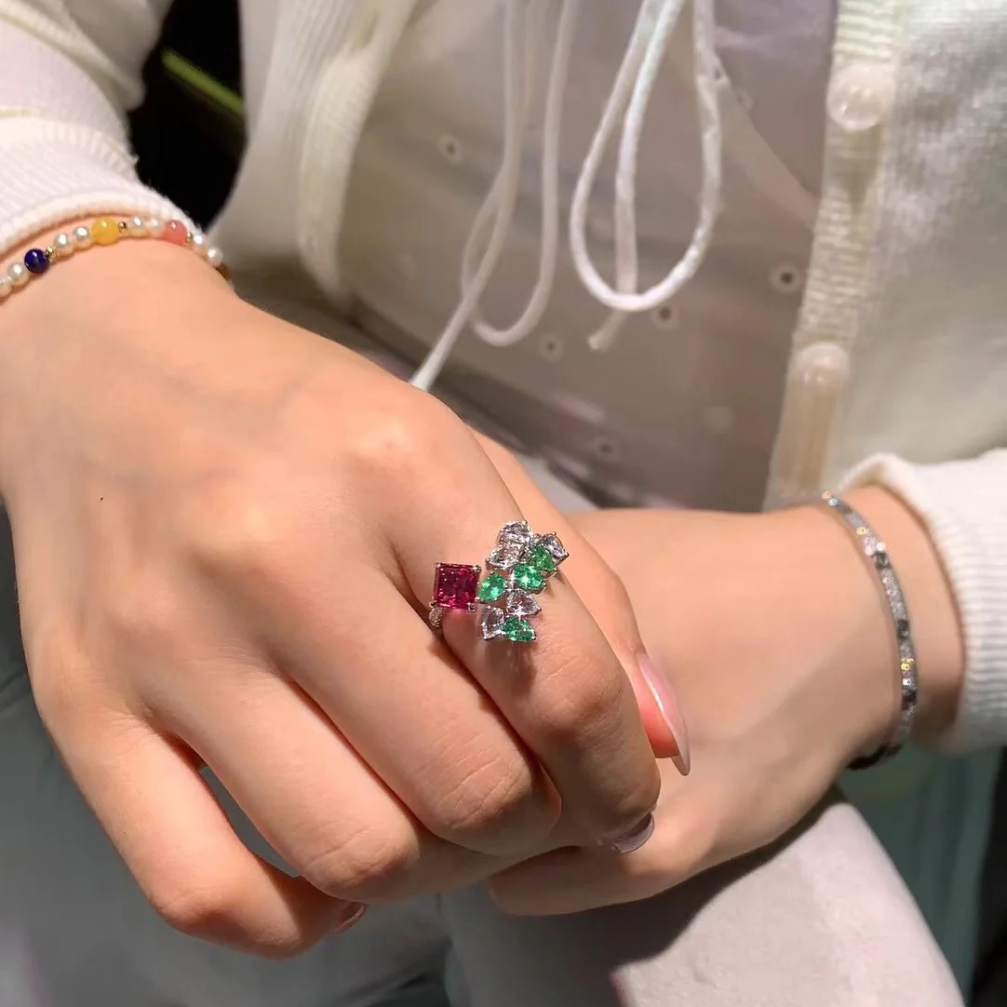 18k gold unheated padparadscha sapphire ring with diamond, emerald, and white topaz inlay