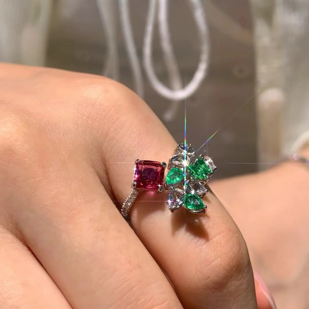 18k gold unheated padparadscha sapphire ring with diamond, emerald, and white topaz inlay